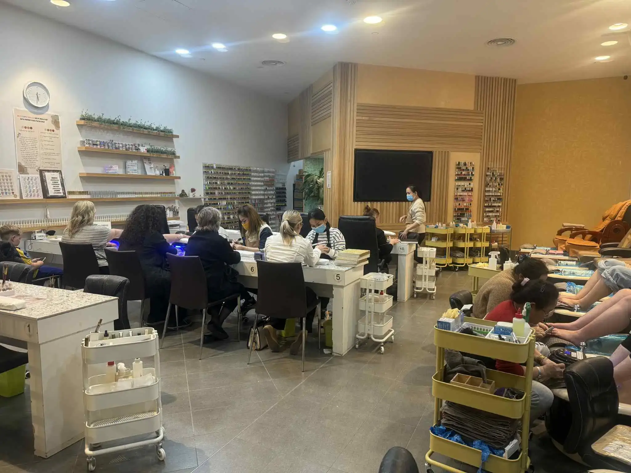 Crowded nail salon during peak hours