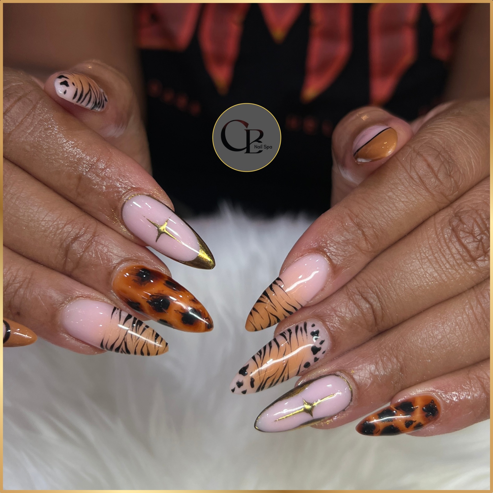 Mixed Animal Print Gold Star Stiletto Nails nail design